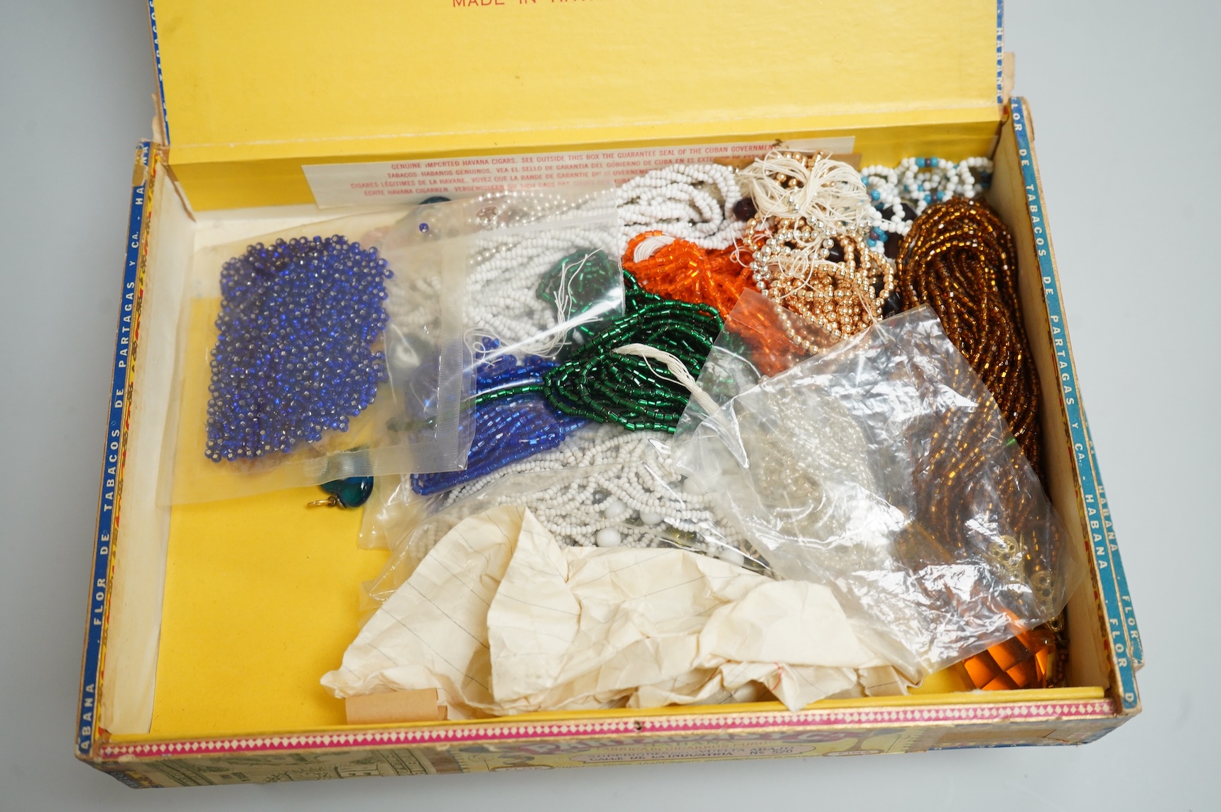 A group of assorted costume jewellery, glass beads etc.